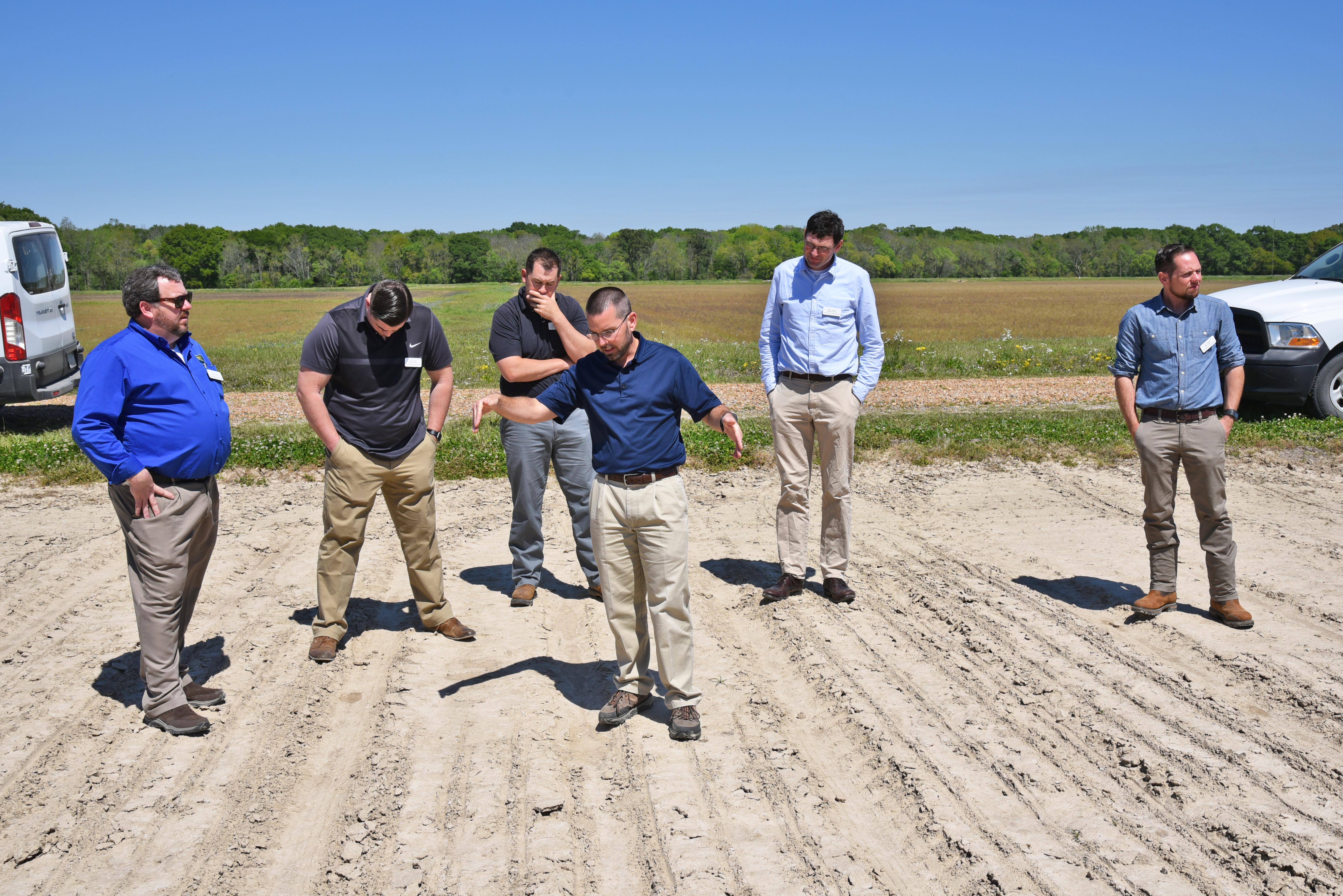 Dustin in the field with leadership class.jpg thumbnail